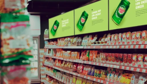 Animated shelf-edge digital signage screen capturing shopper attention at point of purchase